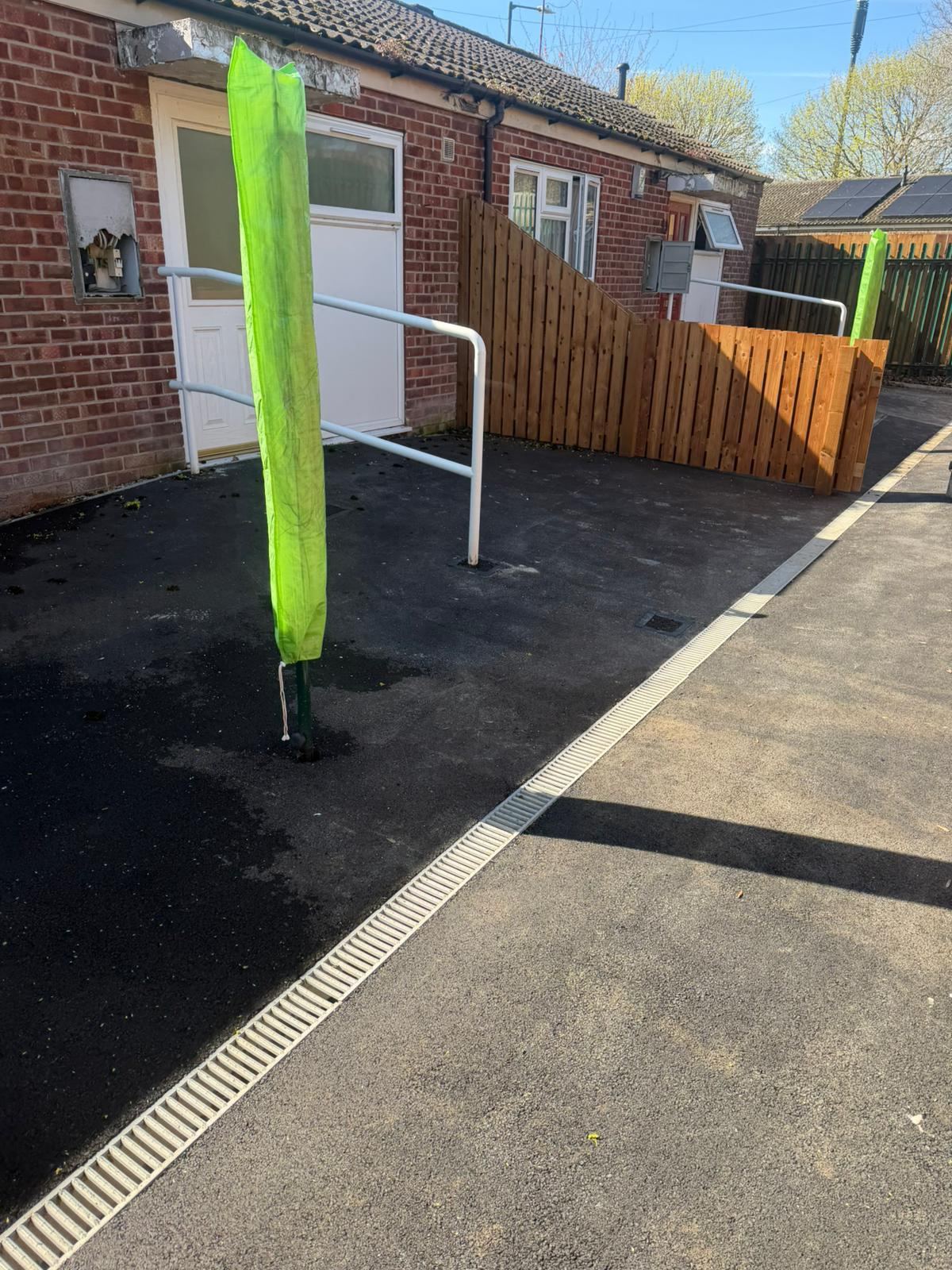 Tarmac frontage with channel drain and handrail