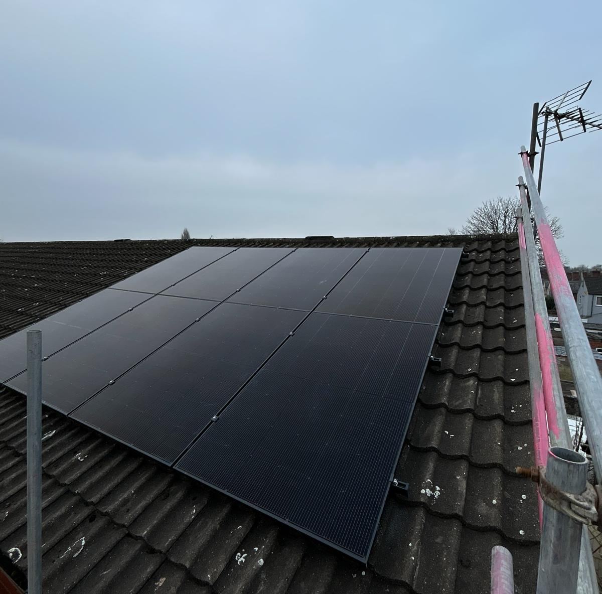 Completed solar PV array on a concrete-tile roof