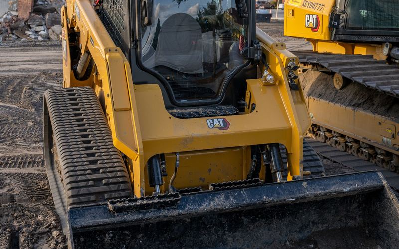 Tracked skidsteer loader for site clearance and loading (illustrative stock photo)