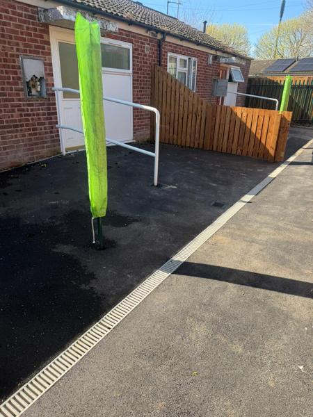 Tarmac frontage with channel drain and handrail