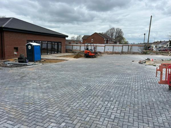 Herringbone block paving to a commercial car park