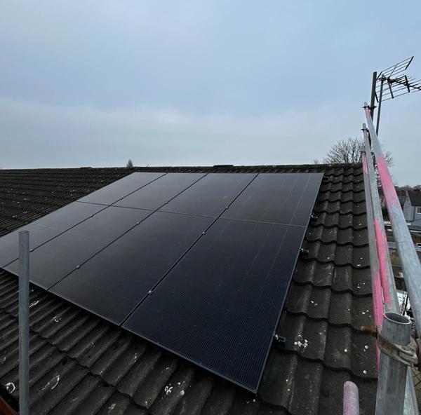 Completed solar PV array on a concrete-tile roof