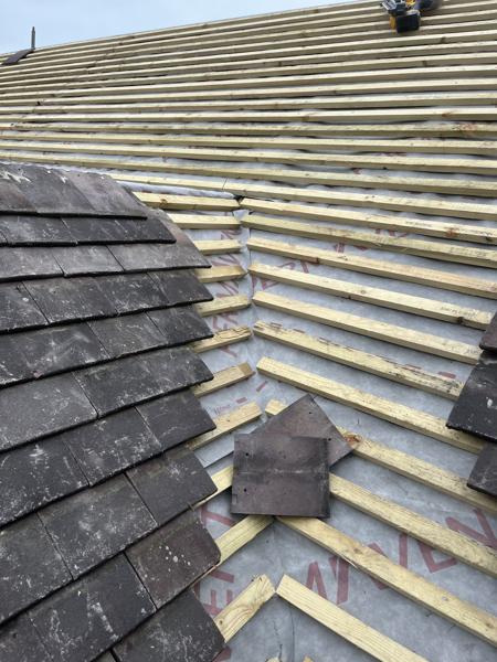 Clay plain tiles being laid on new battens – Staff4dshire Roofing Specialists