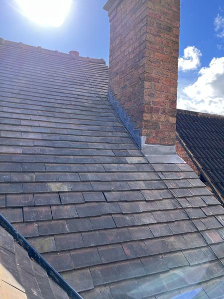 Re-roofed slope with lead flashing to chimney – Staff4dshire Roofing Specialists