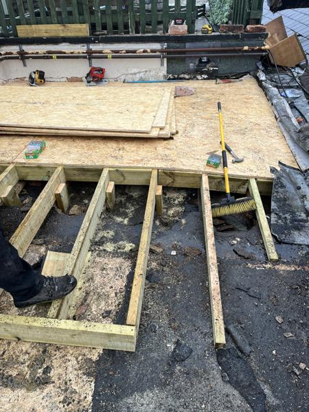 Flat roof deck being boarded on new joists – Staff4dshire Roofing Specialists