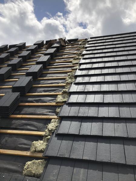Interlocking concrete tiles being laid on a new-build roof – Staff4dshire Roofing Specialists