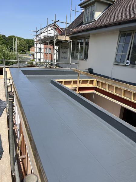 GRP fibreglass flat roof with roof lanterns on an extension – Staff4dshire Roofing Specialists