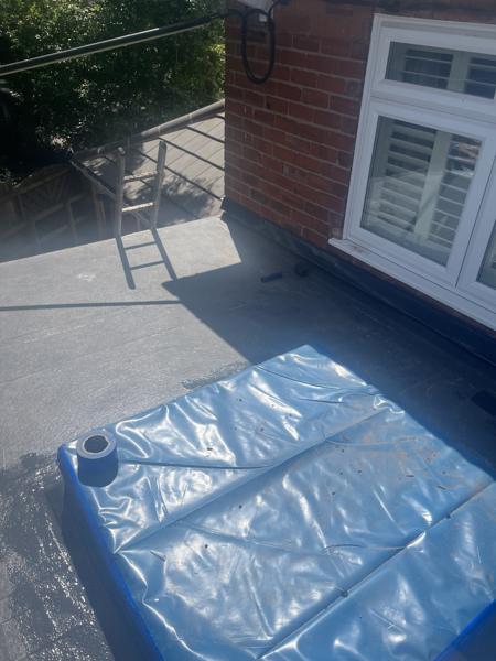 GRP fibreglass flat roof with roof lanterns on an extension – Staff4dshire Roofing Specialists