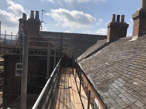 Re-roofed terrace in clay tiles with scaffold access
